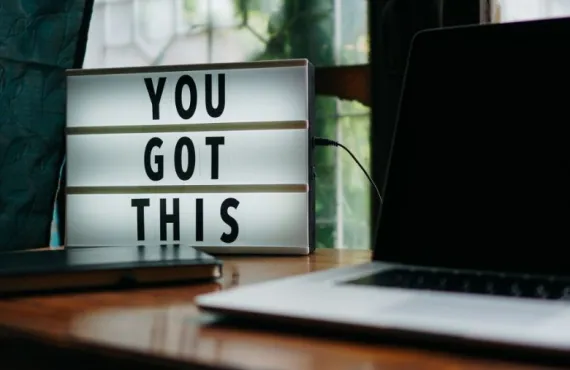 A desk lamp spelling out "You got this"