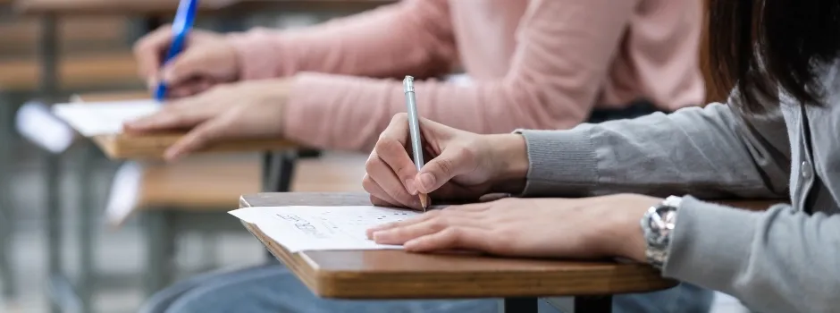 How To Deal With Exam Stress - Woman Writing Exam