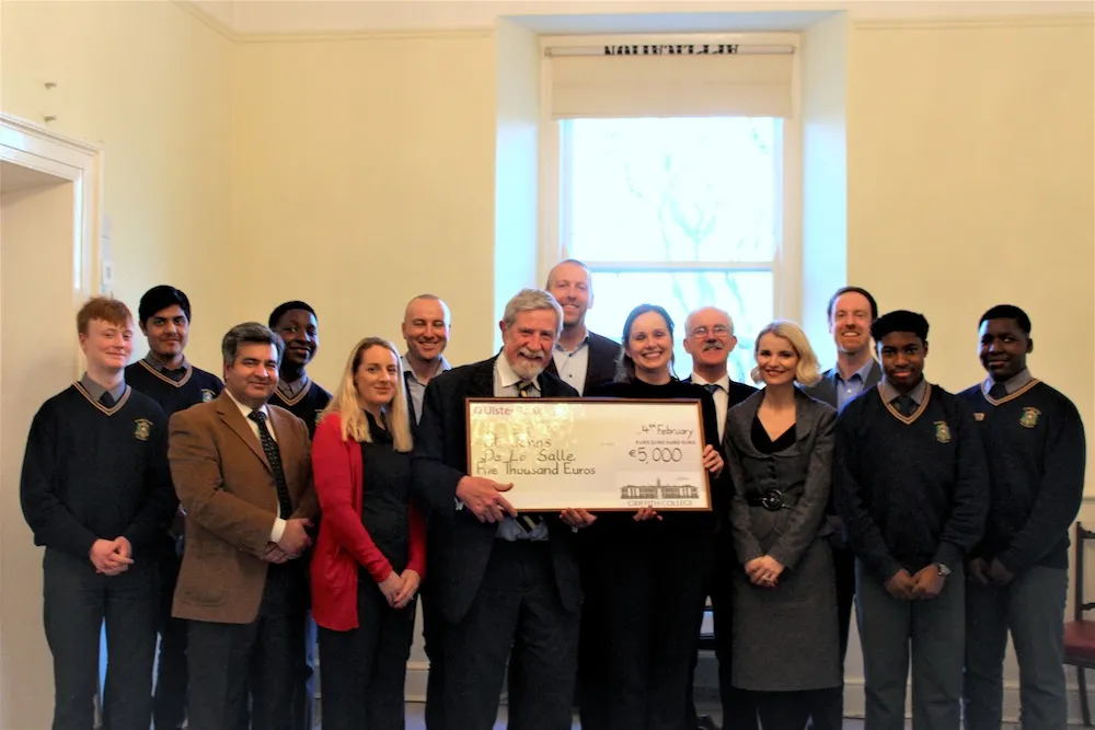 STEAM Bursary at Griffith College Professor Diarmuid Hegarty poses with staff members and representatives of the winning school, handing them a cheque for €5000