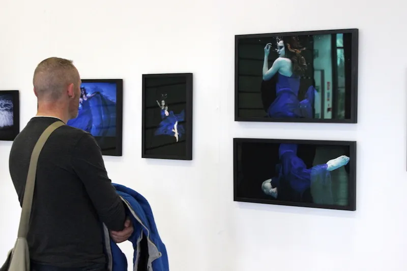 Creative Show 2019 at Griffith College A man views one of the photography collections at the Griffith College Creative Show