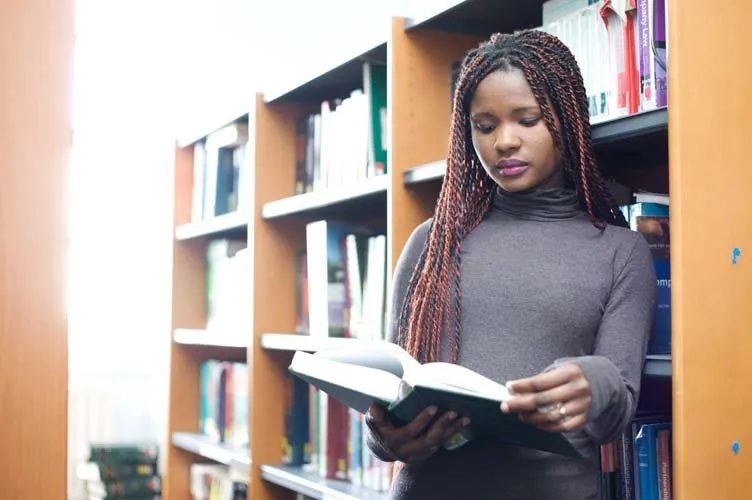 Girl preparing in library Girl preparing in library