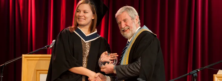Student recieves her parchment from Diarmuid Hegarty Student recieves her parchment from Diarmuid Hegarty