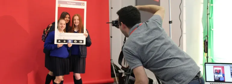 Visit Griffith College Students visit a Griffith College open day and pose with an Instagram frame while their photo is taken